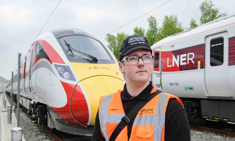 Chris Vaughan Photography - PR and communications images | A train engineer stands in front of an LNER Azuma train.