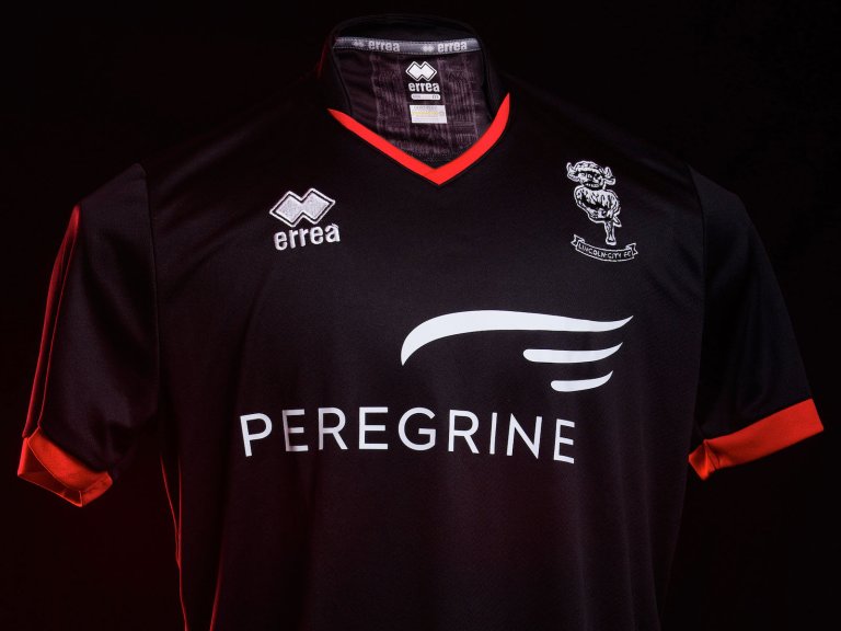 The Lincoln City 2020/21 black away kit, photographed on a mannequin against a black background.