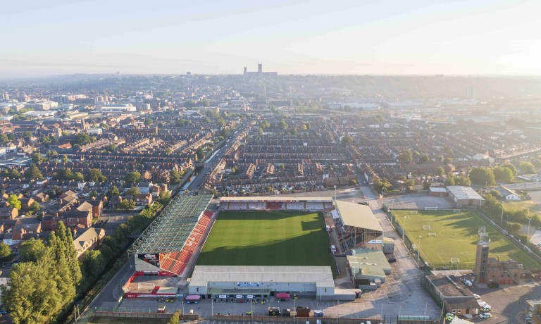 Chris Vaughan Photography - case study: Lincoln City | A general view of the LNER Stadium taken from a drone.