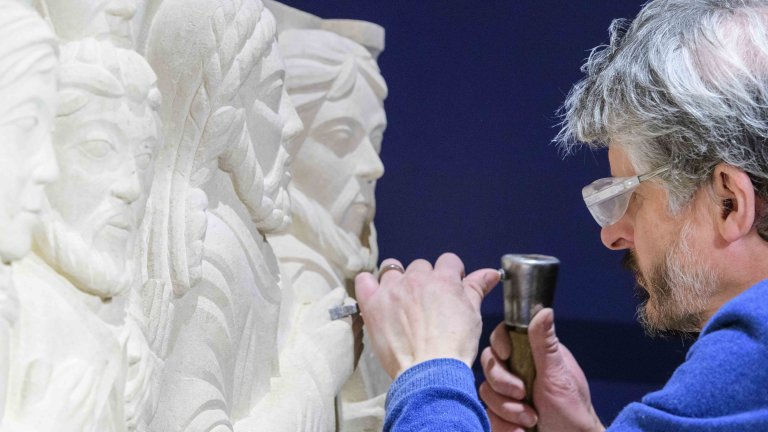 Chris Vaughan - case study images: Lincoln Cathedral | A stone mason works on a carving.